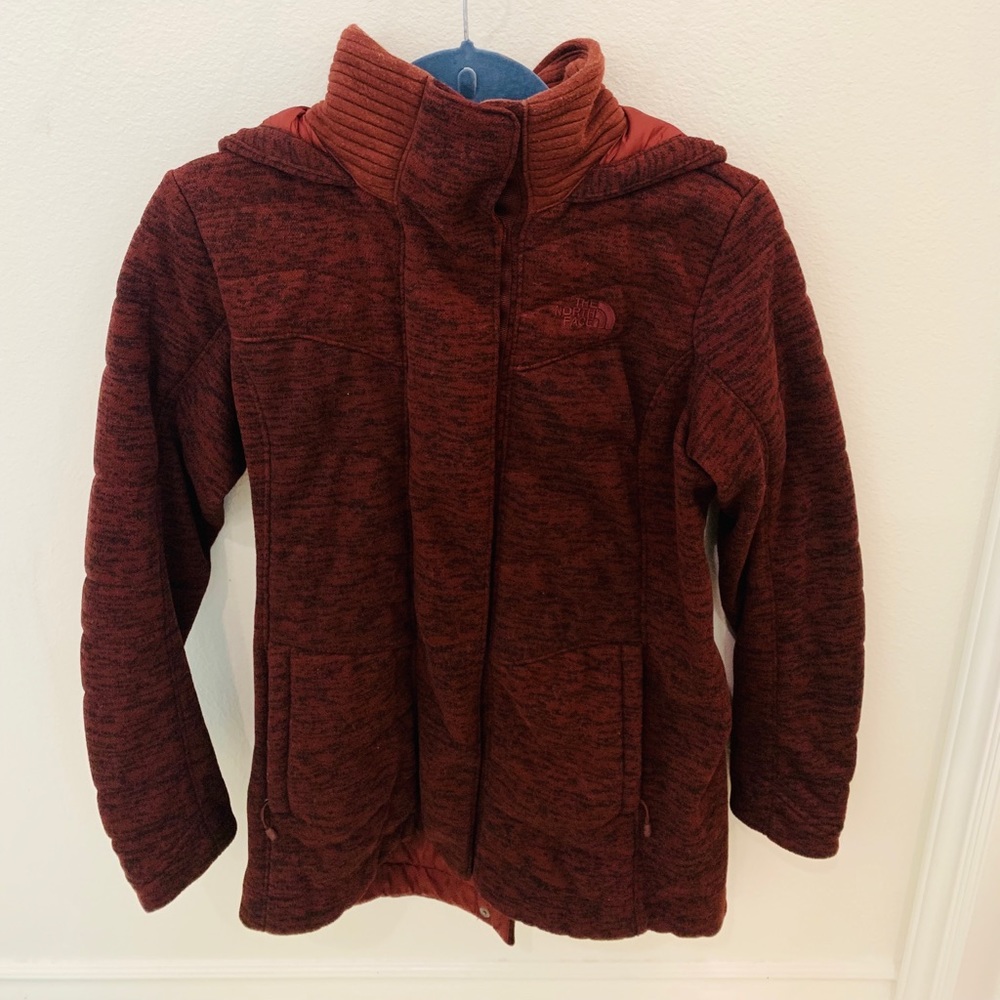 The north face coat color is burgundy